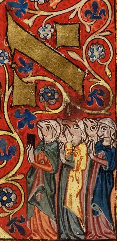 Detail of a medieval illuminated initial: against a vermilion ground patterned with blue acanthus and white roses, a great gold sloping initial fills the upper field, and below it stand four women in long robes — one in green, one in golden-yellow, one in dusky pink, one in dark blue — gesturing in conversation with hands raised, half-figure visible at right.